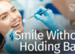 patient smiling in dental chair